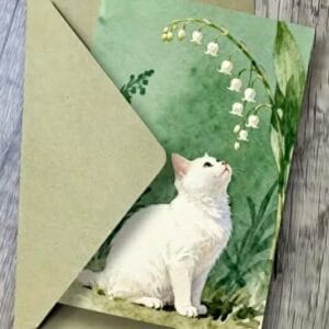 Wenskaart  - witte kat  met meiklokje